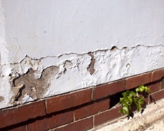 damaged wall at the bottom of the wall