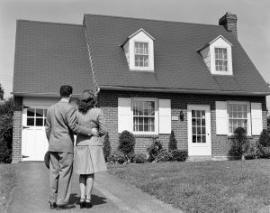 1940s couple looking at a house