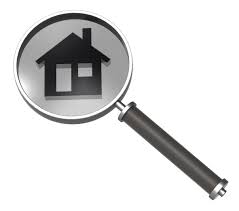 magnifying glass with image of a house