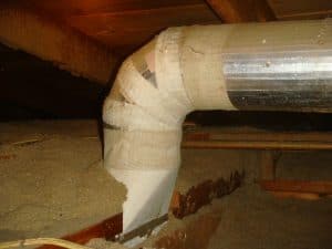 Asbestos within air conditioning vent housed in roof